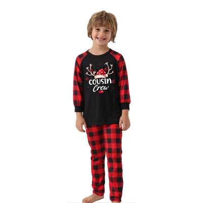 Kids' black and red buffalo plaid Christmas pajamas with 'Cousin Crew' graphic and reindeer antlers. - Image 4