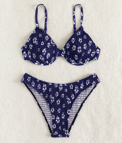 Periwinkle blue two-piece swimsuit with white floral pattern and ruched texture, featuring an underwire bikini top and high-cut bottoms. - Image 25