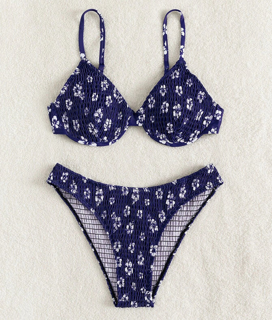 Periwinkle blue two-piece swimsuit with white floral pattern and ruched texture, featuring an underwire bikini top and high-cut bottoms. - Image 25