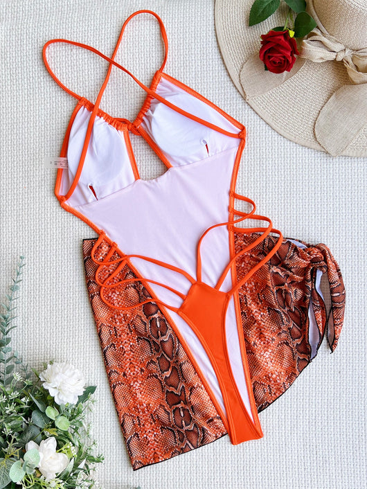 Women's neon green one-piece swimsuit with a tie-front halter neck and side cut-outs, paired with a matching snake print sarong. - Image 24