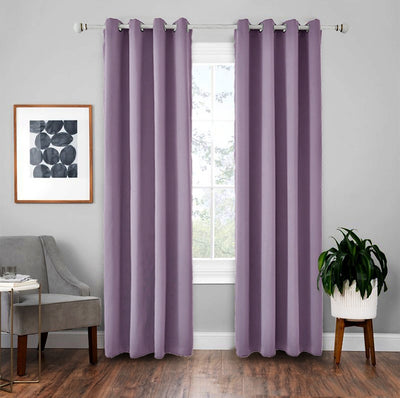 Light gray polyester blackout curtains with grommet tops hanging on a white rod in a modern living room. - Image 11