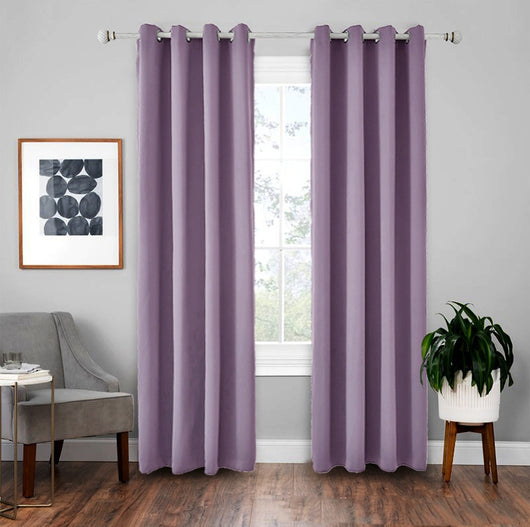 Light gray polyester blackout curtains with grommet tops hanging on a white rod in a modern living room. - Image 11