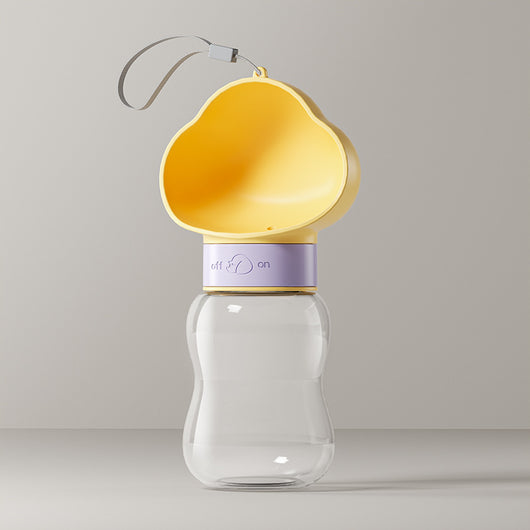 Yellow and clear portable pet water bottle with integrated drinking bowl and separate food container for walking dogs. - Image 9