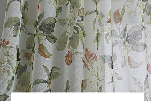 Dark gray semi-sheer curtains with a white and green floral pattern, hung on a black rod in a living room. - Image 8