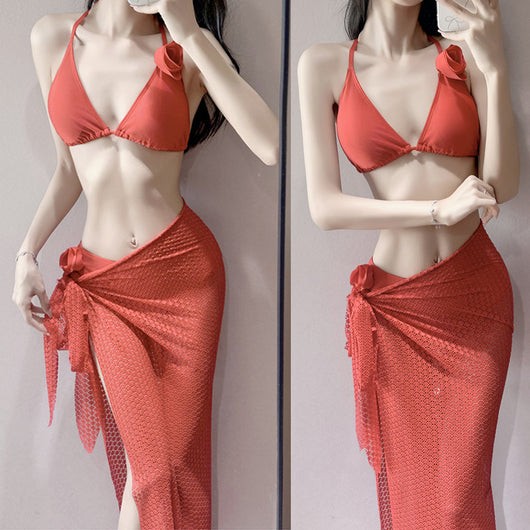 Women's light purple three-piece bikini set with a triangle halter top, bottoms, and a mesh sarong with rose details. - Image 9