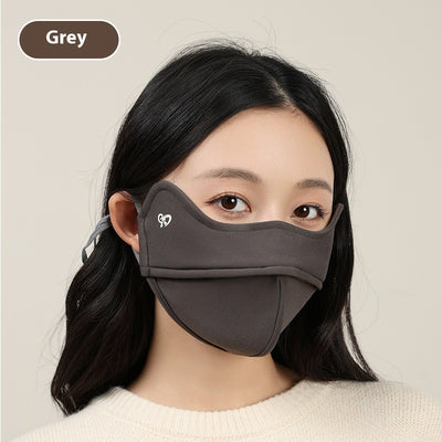 Woman wearing a grey outdoor cycling wind mask with ear hooks and a small heart logo, designed for cold-proof eye protection. - Image 9