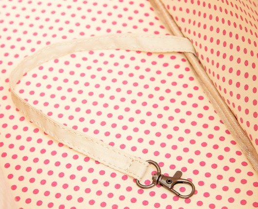 Cream quilted portable pet carrier with top handles, detachable shoulder strap, front pocket, and ventilation mesh. - Image 11