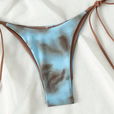Women's two-piece bikini swimsuit with blue and neon yellow tie-dye pattern, featuring a triangle top and tie-side bottom. - Image 3