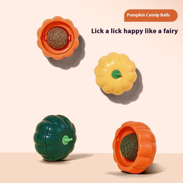 Dark green pumpkin-shaped catnip ball dispenser with a light green stem-like cap for cats.