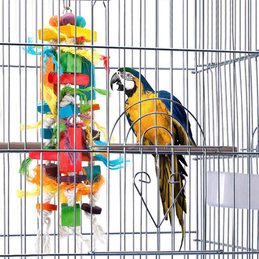 Colorful wooden and rope nibbling toy for parrots, featuring blocks, beads, and knotted ropes, next to a macaw.