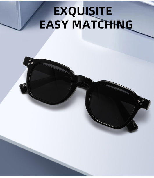 Black square frame sunglasses with dark lenses and small silver accents on the front, shown at an angle. - Image 11