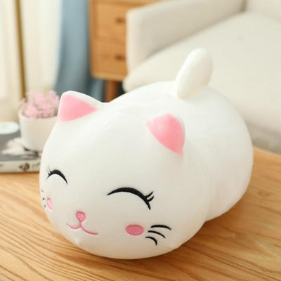 Cute orange cat plush doll with pink ears, black eyes, and embroidered whiskers, resting on a white book. - Image 9