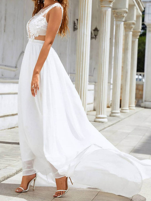 Vestido de Novia Elegante con Encaje Flotante y Vuelo Dramático - Image 5