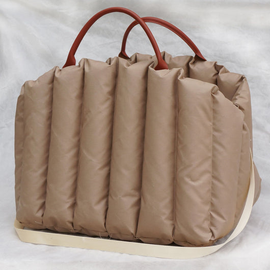 Light khaki quilted portable pet carrier with brown handles and a cream shoulder strap for car travel. - Image 7