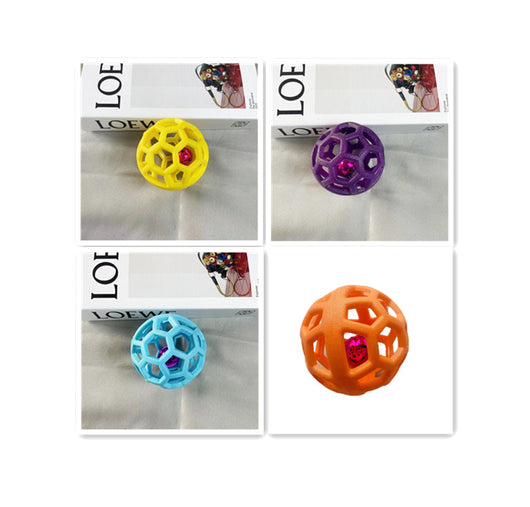Orange TPR hollow lattice dog chew ball with a shiny pink bell ball inside for interactive pet play. - Image 14