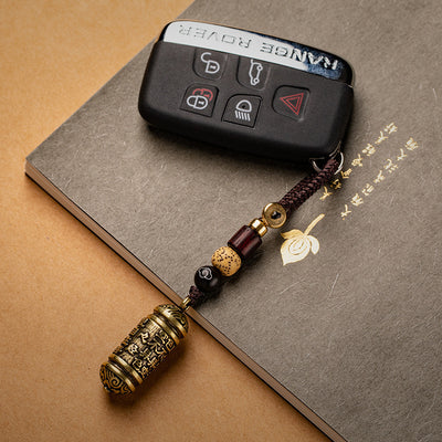 Llavero Colgante Tubo de Latón con Sutra del Corazón Tibetano - Image 9