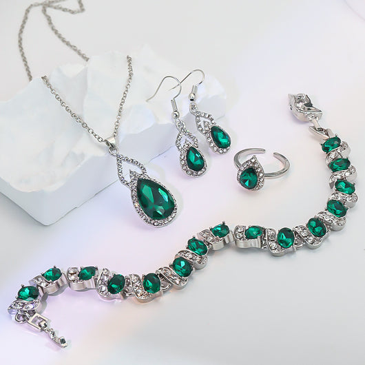 Light luxury jewelry set with silver-tone necklace, dangle earrings, open ring, and bracelet, all featuring emerald green teardrop and oval stones with clear rh - Image 6