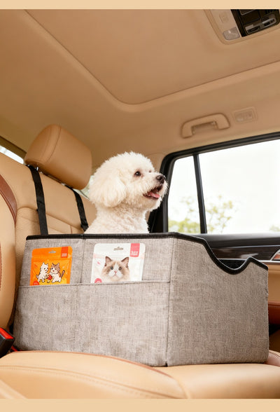 Beige pet car seat with a small white dog inside, secured to a car's passenger seat, designed for safe travel. - Image 19