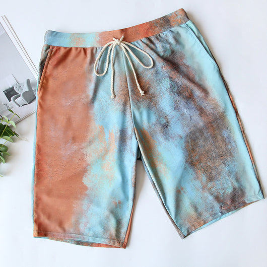 Men's or unisex swim shorts with a blue, orange, and brown abstract tie-dye print, featuring a drawstring waist and side pockets. - Image 6
