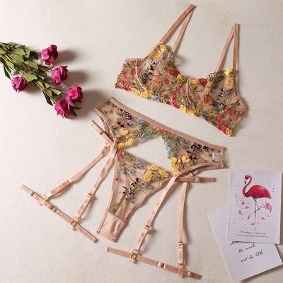 Yellow sheer floral embroidered lingerie set with a bra, thong, and two leg rings, laid flat. - Image 7
