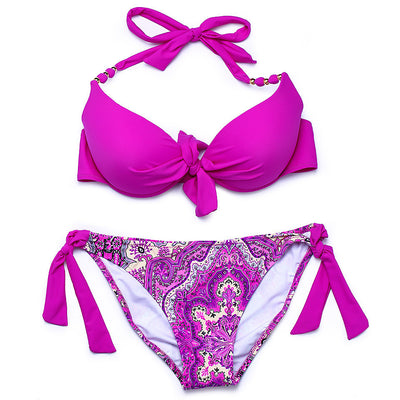 Hot pink halter bikini top with front knot and gold beads, paired with a colorful paisley tie-side bikini bottom. - Image 8