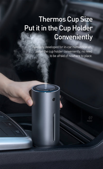 Dark gray cylindrical vehicle-mounted humidifier with a power button, mist outlet, and water level indicator. - Image 11