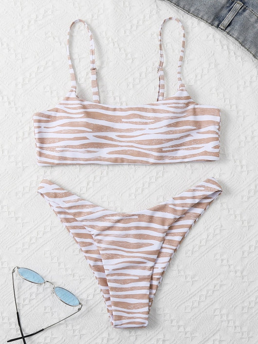 Tan and white zebra stripe two-piece bikini with a bandeau top and high-cut bottom, laid flat. - Image 10