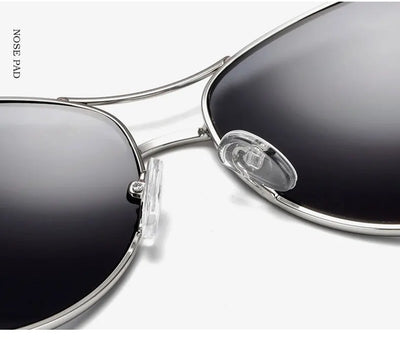Women's large frame fashionable sunglasses with gradient gray lenses, silver-tone metal frames, and white arms. - Image 24