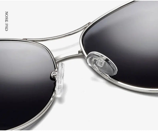 Women's large frame fashionable sunglasses with gradient gray lenses, silver-tone metal frames, and white arms. - Image 24