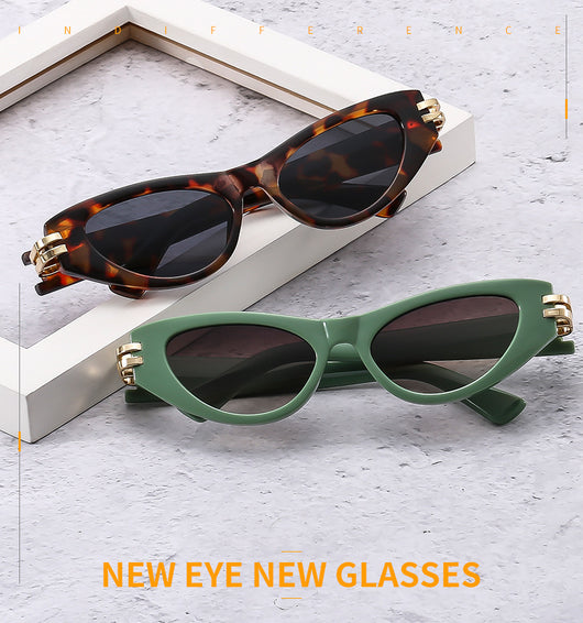 Black cat-eye sunglasses with dark gray lenses and gold-tone hinge accents on a white background. - Image 15