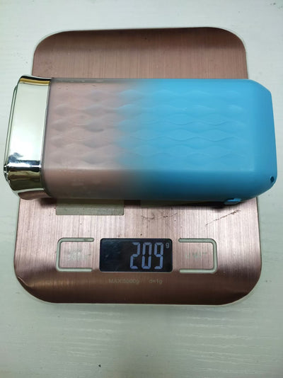 Portable water flosser in gradient pink and blue with four nozzles, a charging cable, and its product box. - Image 28