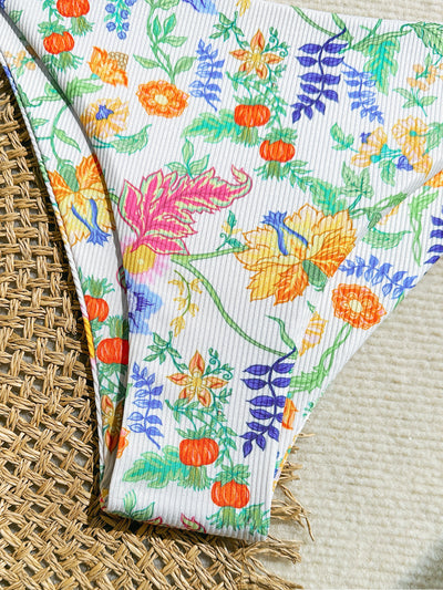 White ribbed two-piece bikini with colorful floral print, featuring a bandeau top and high-cut bottom. - Image 18