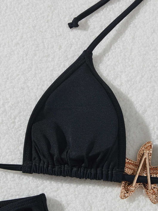 Black three-piece bikini set with triangle top, thong bottom, and skirt, all featuring gold starfish embellishments. - Image 7