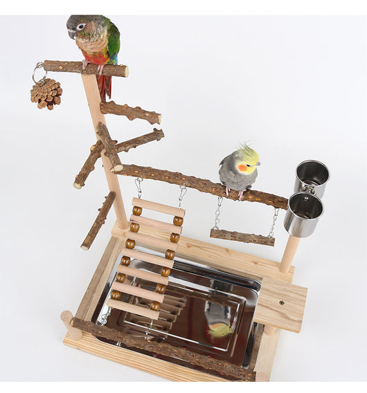 Multi-level natural wood parrot play stand with perches, ladder, swings, and two stainless steel feeding cups. - Image 21