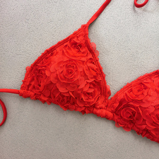 Red three-piece bikini set with a halter top, tie-side thong bottom, and sarong, all featuring a raised floral pattern. - Image 18