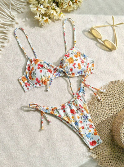 Women's white floral two-piece bikini with red, orange, and blue flowers, featuring a tie-front top and tie-side bottoms. - Image 10