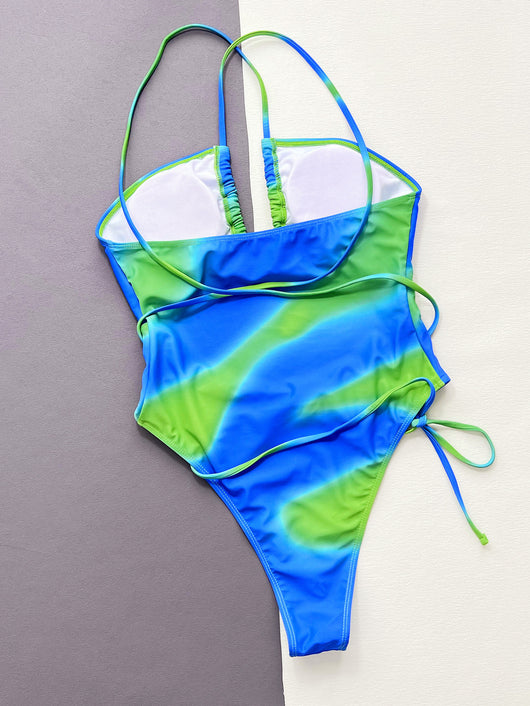 Women's blue and green tie-dye one-piece swimsuit with a tube top, hollow cut-outs, and criss-cross straps. - Image 18
