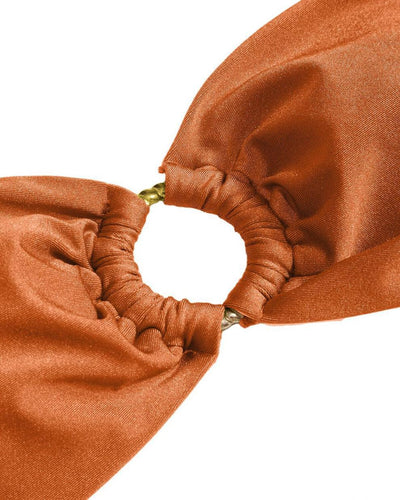 Red glitter bandeau bikini with gold-tone O-rings and side-tie bottoms on a model in a sunny outdoor setting. - Image 65