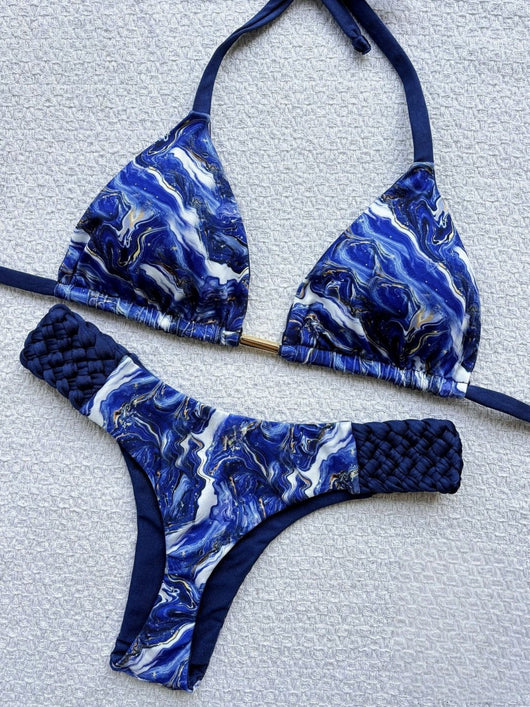 Women's blue, white, and gold marble print bikini with a triangle halter top and braided rope side details. - Image 22