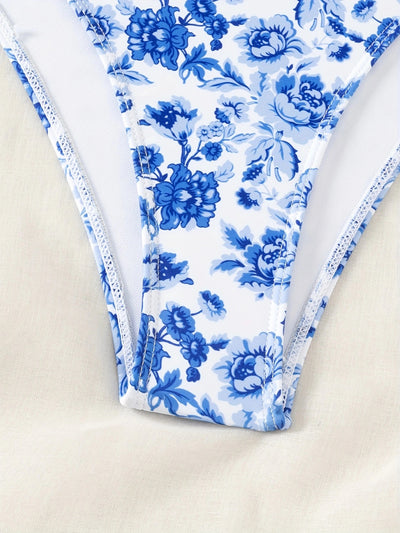 Blue and white floral one-piece swimsuit with a V-bar detail and side cut-outs, perfect for summer. - Image 21