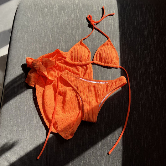 White textured bikini with ruched triangle top, high-cut bottom, and matching sarong with a large bow. - Image 33