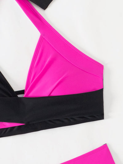 Black and white color-block halter bikini with high-waisted bottoms, modeled by a woman holding a straw hat. - Image 24
