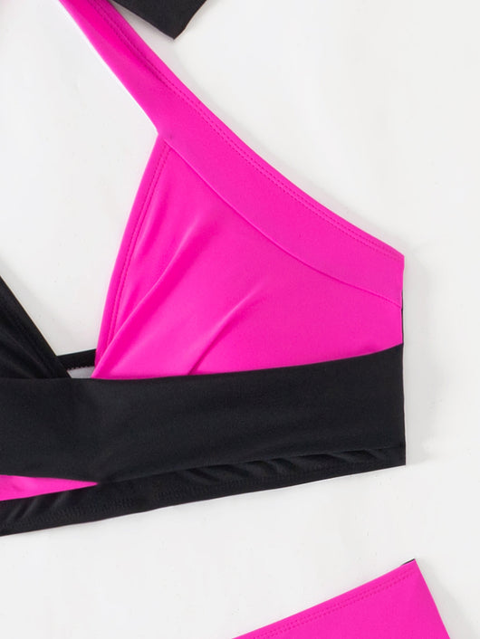 Black and white color-block halter bikini with high-waisted bottoms, modeled by a woman holding a straw hat. - Image 24
