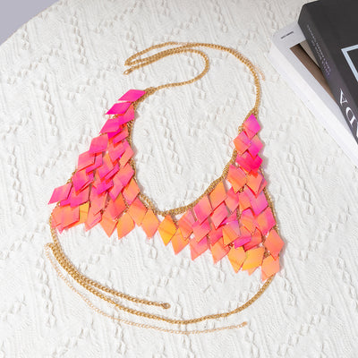 Woman wearing a gold-tone body chain top with iridescent pink and orange diamond-shaped sequins, perfect for beach or festival. - Image 57