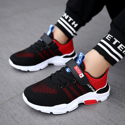 Boy's black and blue sports shoes with orange accents, mesh upper, white sole, blue laces, and a Velcro strap. - Image 24