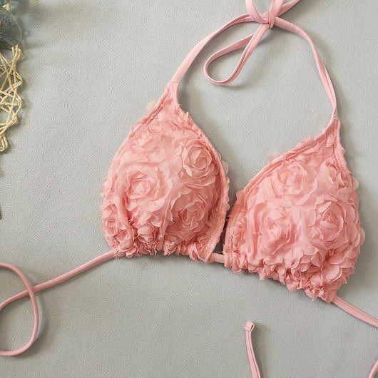 Red three-piece bikini set with a halter top, tie-side thong bottom, and sarong, all featuring a raised floral pattern. - Image 42