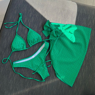 White textured bikini with ruched triangle top, high-cut bottom, and matching sarong with a large bow. - Image 25