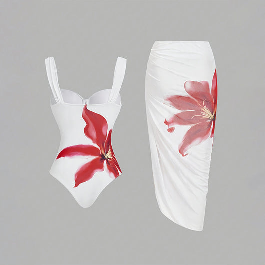 White one-piece swimsuit with red floral print and matching ruched sarong skirt for beach or resort wear. - Image 17