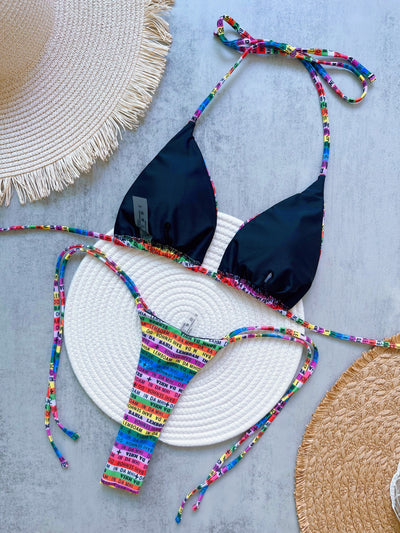 Women's multicolor letter printed lace-up bikini suit with triangle top and thong bottom, displayed on a white mat. - Image 10