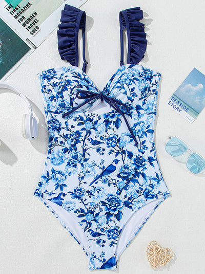 Women's blue and white floral one-piece swimsuit with ruffled straps and a front keyhole tie detail. - Image 14
